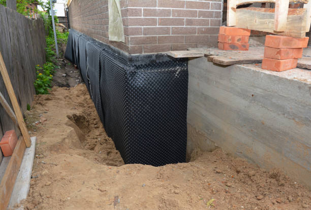SJ Waterproofing Pros technician performing targeted Basement Waterproofing assessment in Smithfield, NC
